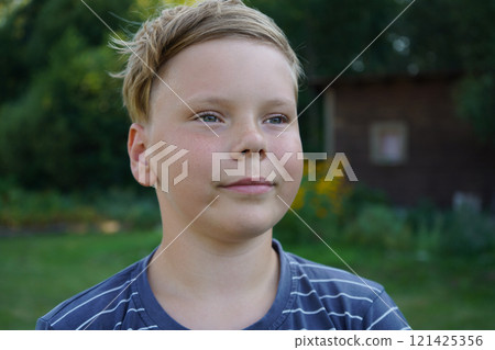 Portrait of a smiling boy on the street 121425356