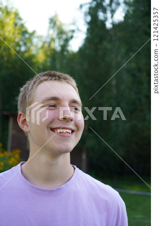 Portrait of an attractive smiling teenager 121425357