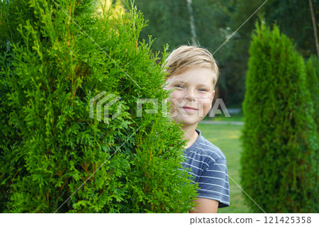 Portrait of a smiling boy on the street 121425358