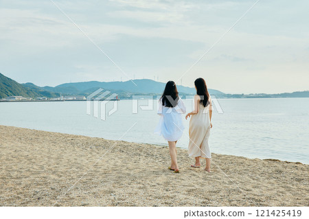 Woman walking on the beach in summer Woman walking on the beach in summer 121425419