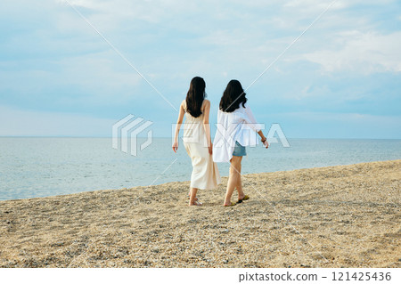 Woman walking on the beach in summer 121425436