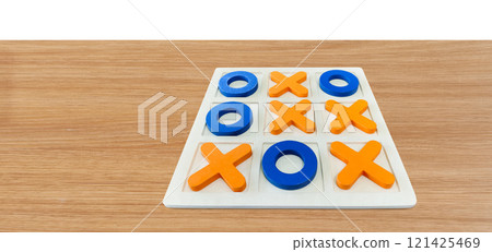 A game of Tic-Tac-To on a wooden table for fun entertainment. A game of Tic-Tac-To on a wooden table for fun entertainment. 121425469