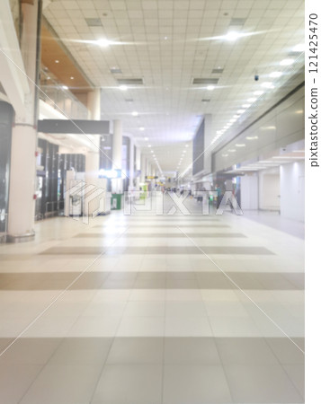 Blurred image of a corridor in the departure hall of an airport. Blurred image of a corridor in the departure hall of an airport. 121425470
