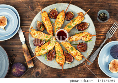 Grilled chicken breast on skewers. Grilled chicken breast on skewers. 121425865