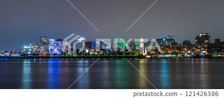 View of downtown Montreal city skyline and Saint Lawrence River at night, Quebec, Canada. 121426386