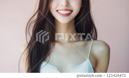 Fashion shoot of smiling young Asian female model wearing dress. Beautiful long hair and slim figure. 121426472