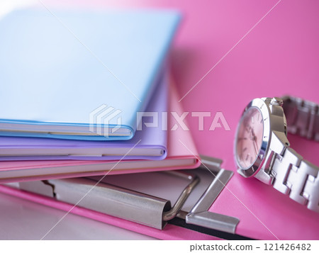Notebook, binder and watch on the table Notebook, binder and watch on the table 121426482