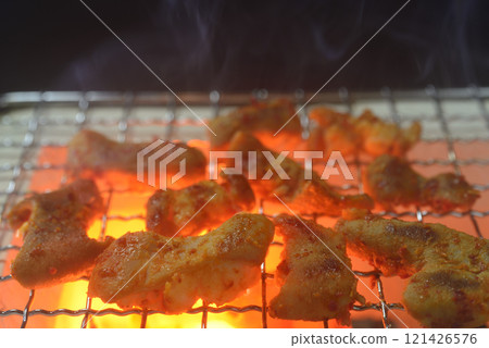 Grilled offal on a charcoal grill with rising smoke Grilled offal on a charcoal grill with rising smoke 121426576