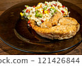 rice, vegetables and fish on dark plate 121426844