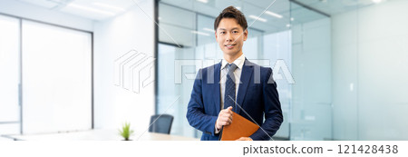 Male businessman with a binder 121428438