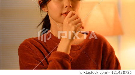 Indoor female portrait 121428725