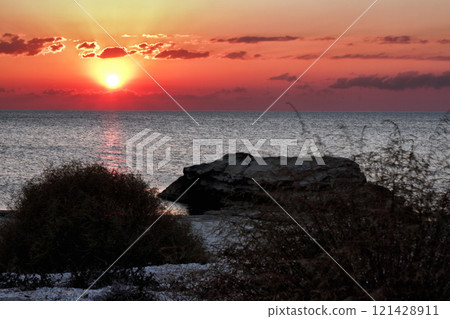 Evening rocky shore of the Caspian Sea. Sunset. Evening rocky shore of the Caspian Sea. Sunset. 121428911
