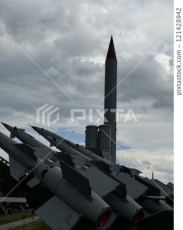 Vintage Missile Display with Dramatic Overcast Sky Vintage Missile Display with Dramatic Overcast Sky 121428942