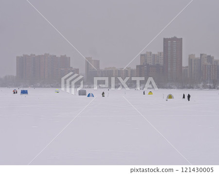 Ice fishing on the river ice in the city. Ice fishing on the river ice in the city. 121430005