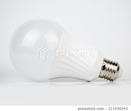 A bright, modern light bulb isolated on white background 121430243