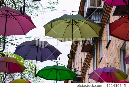 Colorful Umbrellas Hanging Outdoors in Spring 121430845