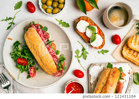 Assorted delicious baguette sandwiches Assorted delicious baguette sandwiches 121431104