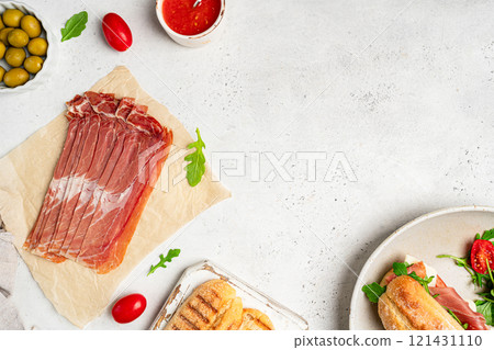 Slices of prosciutto di parma or jamon serrano 121431110