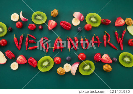 Vegetarian diet month in january called Veganuary. Veganuary word made from red chillies and childish lettering 121431980
