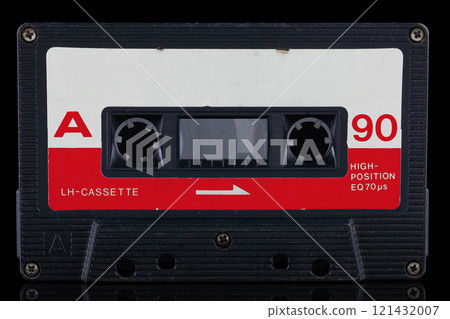 Retro vintage compact cassette on black. Retro vintage compact cassette on black. 121432007