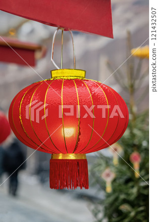 Close-up of red Chinese lantern with golden patterns Close-up of red Chinese lantern with golden patterns 121432507