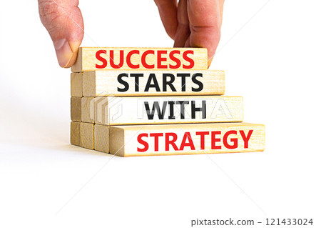 Success starts with strategy symbol. Concept words Success starts with strategy on beautiful wooden blocks. Beautiful white background. Business and success starts with strategy concept. Copy space. Success starts with strategy symbol. Concept words Success starts with strategy on beautiful wooden blocks. Beautiful white background. Business and success starts with strategy concept. Copy space. 121433024