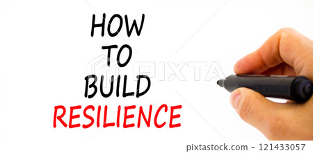 How to build resilience symbol. Concept words How to build resilience on beautiful white paper. Beautiful white background. Businessman hand. Business and how to build resilience concept. Copy space 121433057