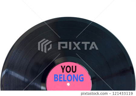Belonging and you belong symbol. Concept words You belong on beautiful purple and black vinyl disk. Beautiful white background. Business belonging and you belong concept. Copy space. 121433119