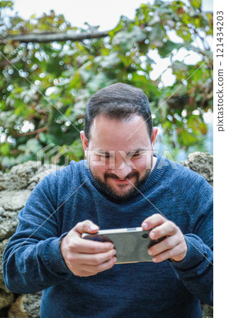 Man Laughs While Winning Phone Game 121434203