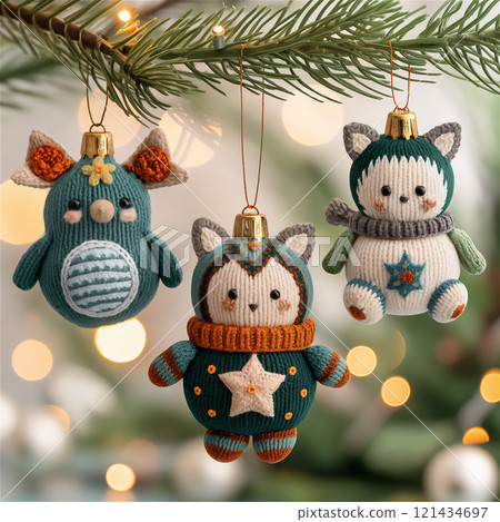 Three adorable stuffed animals are hanging from a christmas tree branch Three adorable stuffed animals are hanging from a christmas tree branch 121434697