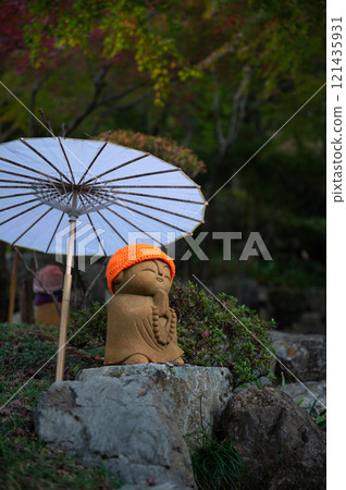 Gassho Jizo and Japanese umbrella 121435931