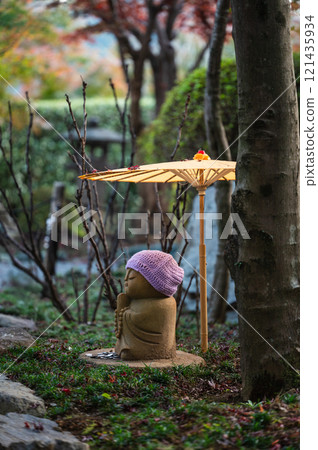 Jizo statue standing in the garden Jizo statue standing in the garden 121435934