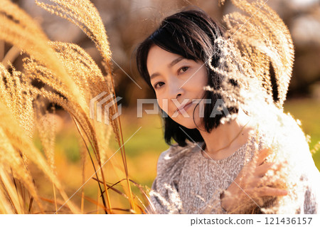 Japanese silver grass and middle-aged woman Japanese silver grass and middle-aged woman 121436157