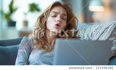 Caucasian woman with laptop and displeased expression 121436160