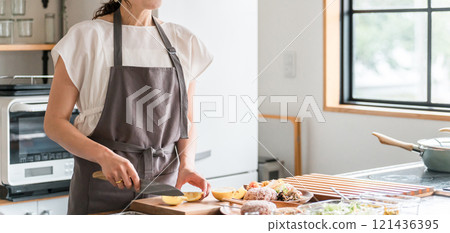 Young Asian woman cooking in the kitchen (cutting, knife, cooking, homemade food, no face) Young Asian woman cooking in the kitchen (cutting, knife, cooking, homemade food, no face) 121436395