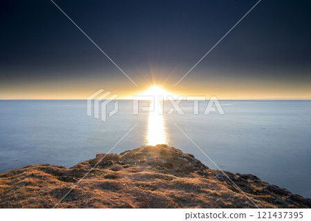 Panoramic view of sunrise on the coast from Dyrholaey, Iceland Panoramic view of sunrise on the coast from Dyrholaey, Iceland 121437395