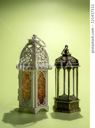 Arabic lanterns on a colored background. Decoration for Muslim holidays celebration 121437512