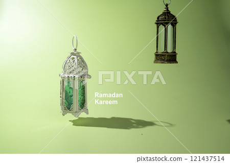 Arabic lanterns hanging on a colored background. Decoration for Muslim holidays celebration Arabic lanterns hanging on a colored background. Decoration for Muslim holidays celebration 121437514