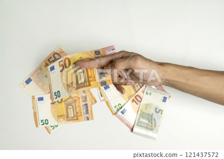 Human hand holding euro banknote cash on white background 121437572