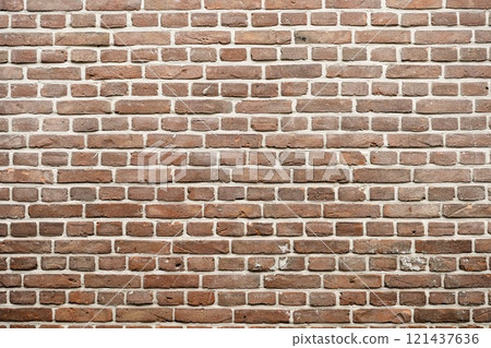 Closeup view of the red wall. Abstract pattern of a brick wall 121437636