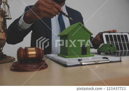 Auctioneer knocks down property sale by sample house and lawyer's gavel, judge mediates in property dispute in court car judge's gavel on wooden background Buying and selling real estate, housing Auctioneer knocks down property sale by sample house and lawyer's gavel, judge mediates in property dispute in court car judge's gavel on wooden background Buying and selling real estate, housing 121437721