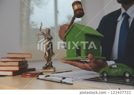 Auctioneer knocks down property sale by sample house and lawyer's gavel, judge mediates in property dispute in court car judge's gavel on wooden background Buying and selling real estate, housing Auctioneer knocks down property sale by sample house and lawyer's gavel, judge mediates in property dispute in court car judge's gavel on wooden background Buying and selling real estate, housing 121437722