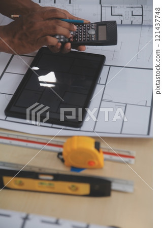 Image of engineer meeting for architectural project. working with partner and engineering tools on workplace vintage tone. 121437748