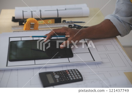 Image of engineer meeting for architectural project. working with partner and engineering tools on workplace vintage tone. 121437749