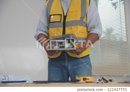 Image of engineer meeting for architectural project. working with partner and engineering tools on workplace vintage tone. 121437755