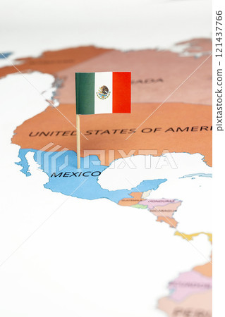 A map of Mexico with the national flag of Mexico on it. The flag is a Vertically striped green-white-red national flag with a central coat of arms 121437766