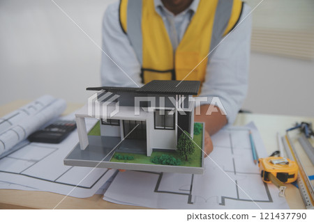 Architects, engineers, contractors working in the office with blueprints, inspection engineers Work analysis for architectural plan, construction project sketch, focus, business construction concept. 121437790