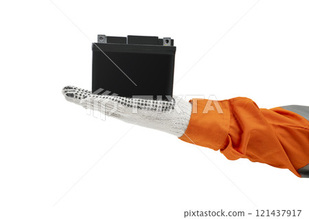 Mechanic hand in glove holding black motorcycle battery isolated over white background 121437917