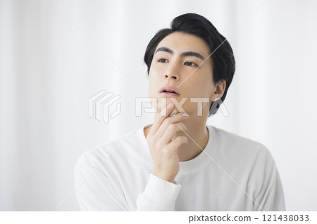 Thinking young man Thinking young man 121438033