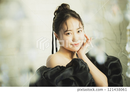 A woman in a black dress A woman in a black dress 121438061